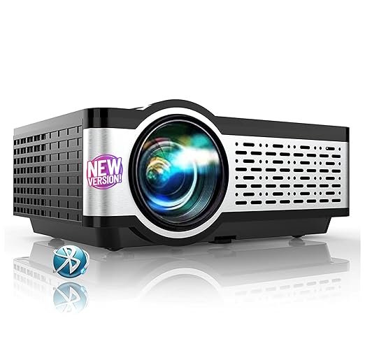 E Gate i9 Pro-Max 4K Supported Full HD Bluetooth Projector E Gate i9 Pro-Max Bluetooth projector in black and silver with large front lens, side ventilation grille, and “New Version” badge.