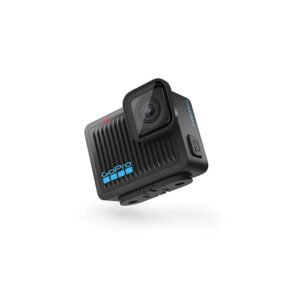 A compact, black GoPro HERO action camera angled slightly to the right against a white background, highlighting its rugged ribbed front casing, lens, and built-in folding mounting fingers.