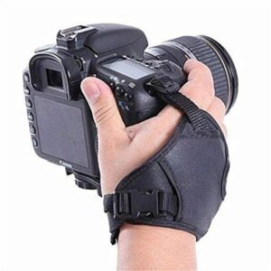 HIFFIN black PU leather camera hand grip wrist strap attached to a DSLR camera, providing secure and comfortable one-hand support