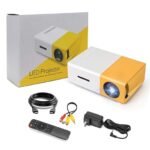 Technoview Pro mini LED projector in white and yellow with retail box, remote control, HDMI cable, AV cable, and power adapter included.